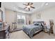 Relaxing bedroom with tray ceiling, ceiling fan, and a large window at 51 Balboa Parkway Pkwy, Clayton, NC 27520