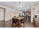 Dining area leading into a kitchen, with wood flooring and four-chair dining set at 51 Balboa Parkway Pkwy, Clayton, NC 27520