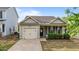 Charming single-story home with a well-manicured lawn and inviting covered front porch at 51 Balboa Parkway Pkwy, Clayton, NC 27520