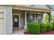 Charming front porch with welcoming decor, dark shutters, and lush landscaping at 51 Balboa Parkway Pkwy, Clayton, NC 27520