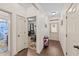 Bright hallway featuring hardwood floors, neutral walls, and doors leading to various rooms at 51 Balboa Parkway Pkwy, Clayton, NC 27520