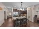 Stylish kitchen featuring an island with granite countertop, stainless steel appliances, and dark wood cabinetry at 51 Balboa Parkway Pkwy, Clayton, NC 27520