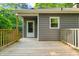 Wooden deck with access to back door and a window, adding natural light at 5212 Badham Pl, Raleigh, NC 27609