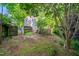Backyard with deck, stairs and lots of greenery and a privacy fence at 5212 Badham Pl, Raleigh, NC 27609