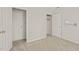 Neutral bedroom features plush carpeting, and a closet for ample storage at 5212 Badham Pl, Raleigh, NC 27609