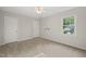 Bedroom featuring carpeted flooring, windows and ceiling fan at 5212 Badham Pl, Raleigh, NC 27609