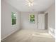Cozy bedroom with carpeted flooring, windows and a ceiling fan at 5212 Badham Pl, Raleigh, NC 27609