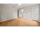 Neutral bedroom features hardwood floors and a ceiling fan at 5212 Badham Pl, Raleigh, NC 27609