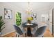 Cozy dining room featuring a modern chandelier and a round dining table at 5212 Badham Pl, Raleigh, NC 27609