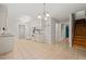 Bright kitchen features tiled floors, white appliances, and ample counter space at 5212 Badham Pl, Raleigh, NC 27609