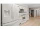 Kitchen featuring stainless steel appliances, white cabinets, tile floors, and a refrigerator with water dispenser at 5212 Badham Pl, Raleigh, NC 27609
