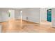 Open living area with hardwood floors, neutral paint, and access to other rooms at 5212 Badham Pl, Raleigh, NC 27609