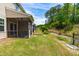 View of the back of the townhomes with private screened-in porches and tree-lined property at 525 Durants Neck Ln, Morrisville, NC 27560