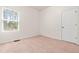 Neutral bedroom with a window and light colored carpet at 525 Durants Neck Ln, Morrisville, NC 27560