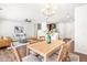 Open concept layout with hardwood floors and natural light streaming in from the windows at 525 Durants Neck Ln, Morrisville, NC 27560