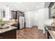 Well-equipped kitchen featuring granite countertops, stainless steel appliances, and wood floors at 525 Durants Neck Ln, Morrisville, NC 27560