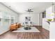 Spacious living room with ample natural light, modern furniture, and hardwood floors at 525 Durants Neck Ln, Morrisville, NC 27560