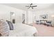 Spacious main bedroom boasting a ceiling fan, sitting area, and views of the rest of the home at 525 Durants Neck Ln, Morrisville, NC 27560
