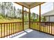 Comfortable screened porch with wooded views and concrete flooring, perfect for relaxing outdoors at 525 Durants Neck Ln, Morrisville, NC 27560