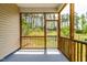 Comfortable screened porch with wooded views and concrete flooring, perfect for relaxing outdoors at 525 Durants Neck Ln, Morrisville, NC 27560