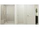 Bathroom featuring glass enclosed shower with bench and neutral tile work at 545 Morning Light Dr, Angier, NC 27501