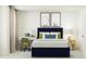 Comfortable bedroom with cozy décor featuring a writing desk, stylish pillows, and eye-catching art prints at 545 Morning Light Dr, Angier, NC 27501