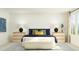 Bright bedroom with a stylish bed, bedside tables with lamps, and a patterned rug at 545 Morning Light Dr, Angier, NC 27501