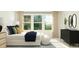 Bright bedroom with a large window, comfortable bed, and tasteful decor at 545 Morning Light Dr, Angier, NC 27501
