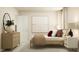 Inviting bedroom featuring a wooden dresser, minimalist decor, and a comfortable bed with soft pillows at 548 Morning Light Dr, Angier, NC 27501