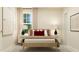Warm bedroom with a wooden bed frame, neutral bedding, and matching bedside lamps at 548 Morning Light Dr, Angier, NC 27501
