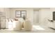 Inviting living room featuring a plush sofa, modern lighting, and minimalist decor for a comfortable space at 548 Morning Light Dr, Angier, NC 27501