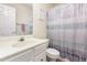 Well-lit bathroom with a single sink vanity and neutral finishes at 5504 Crabtree Park Ct, Raleigh, NC 27612