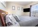 Bedroom featuring a cozy bed with plush pillows and bright natural light at 5504 Crabtree Park Ct, Raleigh, NC 27612
