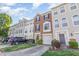 View of several townhomes featuring one car garages and well manicured front yards at 5504 Crabtree Park Ct, Raleigh, NC 27612