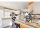 Eat in kitchen with modern appliances, white cabinets, and a unique wood table at 5504 Crabtree Park Ct, Raleigh, NC 27612
