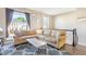 Comfortable living room with a large sectional sofa and bright natural light at 5504 Crabtree Park Ct, Raleigh, NC 27612