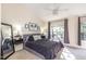 Spacious main bedroom featuring a large window and modern decor at 5504 Crabtree Park Ct, Raleigh, NC 27612