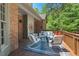 Inviting back deck features comfortable seating, perfect for enjoying the serene outdoor space at 5524 Jomali Dr, Durham, NC 27705