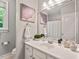 Bright bathroom features a large mirror, single vanity, and neutral decor at 5524 Jomali Dr, Durham, NC 27705