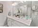 Bright bathroom with double sink vanity, large mirror, and modern fixtures at 5524 Jomali Dr, Durham, NC 27705