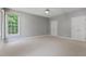 Spacious bedroom with neutral carpet and paint with plenty of natural light at 5524 Jomali Dr, Durham, NC 27705