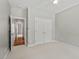 Neutral bedroom features a ceiling fan, carpeted floor, and double door closet for ample storage at 5524 Jomali Dr, Durham, NC 27705