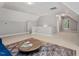 Large living room with neutral carpet, a decorative rug, and ample natural light at 5524 Jomali Dr, Durham, NC 27705