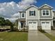 Charming townhome featuring a one-car garage, gray siding, and lovely landscaping on a well-maintained green lawn at 58 Twin Birch Dr, Angier, NC 27501