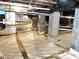 Clean basement with sealed flooring, block pillars, and updated pipes creating a dry and secure foundation at 5901 Charleycote Dr, Raleigh, NC 27614