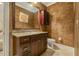 Elegant half-bathroom with decorative walls, a stylish mirror, and a granite countertop at 5901 Charleycote Dr, Raleigh, NC 27614