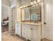This bathroom features double vanities with granite countertops and access to the main bedroom at 5901 Charleycote Dr, Raleigh, NC 27614