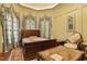 Comfortable bedroom featuring decorative draperies, traditional furniture, and luxurious bedding at 5901 Charleycote Dr, Raleigh, NC 27614