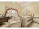Comfortable bedroom featuring a decorative bed frame, chair, and window with stylish curtains at 5901 Charleycote Dr, Raleigh, NC 27614