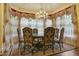 Dining room with decorative chandelier, detailed curtains, and a formal dining table with seating for six at 5901 Charleycote Dr, Raleigh, NC 27614